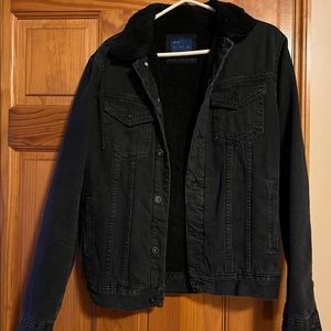 Zara Men’s black fur lined jean jacket.